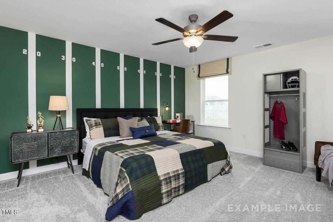 225 Highland Ridge Lane Knightdale, NC 27545 - Photo 38 of 38 a bedroom with a large bed and a window