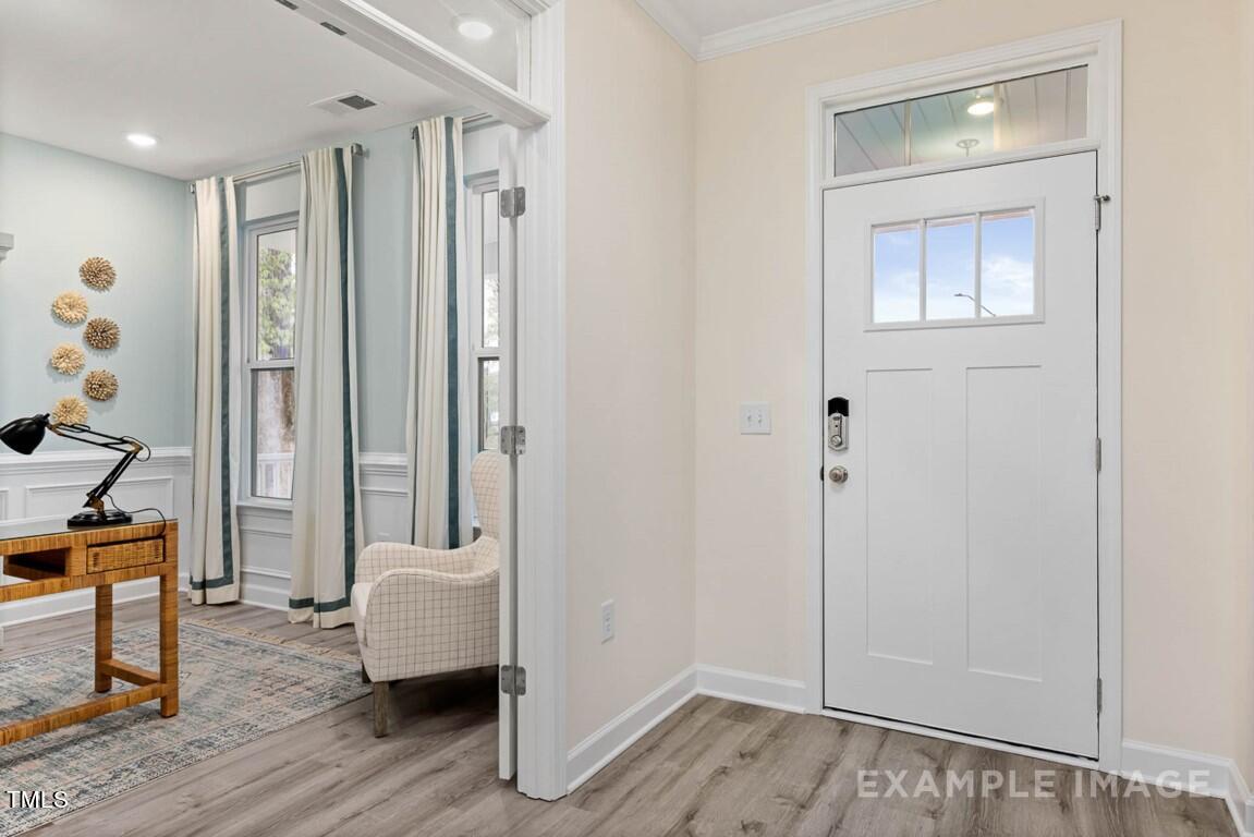 225 Highland Ridge Lane Knightdale, NC 27545 - Photo 6 of 38 a view of entryway with wooden floor