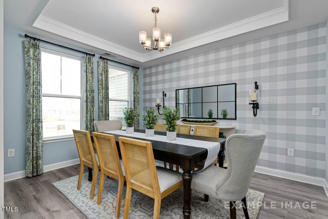 225 Highland Ridge Lane Knightdale, NC 27545 - Photo 10 of 38 a dining room with furniture and window