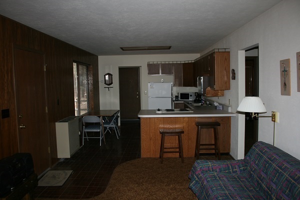 6 Cr 2084 Alpine, AZ 85920 - Photo 16 of 25 a kitchen with stainless steel appliances granite countertop a stove a sink and a refrigerator