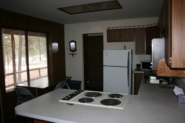 6 Cr 2084 Alpine, AZ 85920 - Photo 17 of 25 a kitchen with a refrigerator a stove a sink and a refrigerator