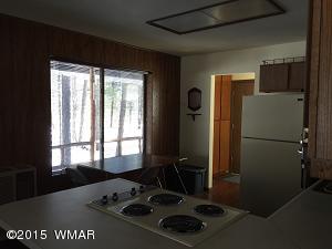 6 Cr 2084 Alpine, AZ 85920 - Photo 10 of 25 a kitchen with a refrigerator a stove a sink and a window