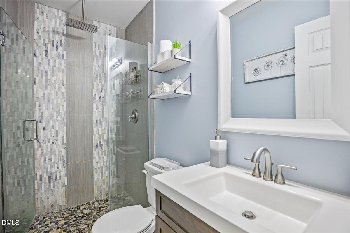 107 Claymont Road Louisburg, NC 27549 - Photo 13 of 30 a bathroom with a sink toilet and shower