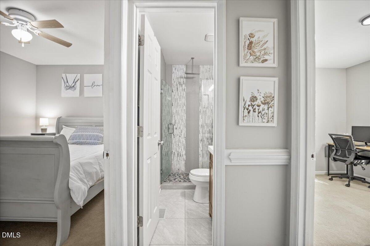 107 Claymont Road Louisburg, NC 27549 - Photo 15 of 30 a bathroom with a sink and a toilet