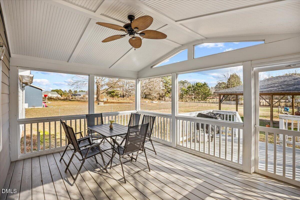 107 Claymont Road Louisburg, NC 27549 - Photo 19 of 30 a view of a dining room with furniture window and wooden floor