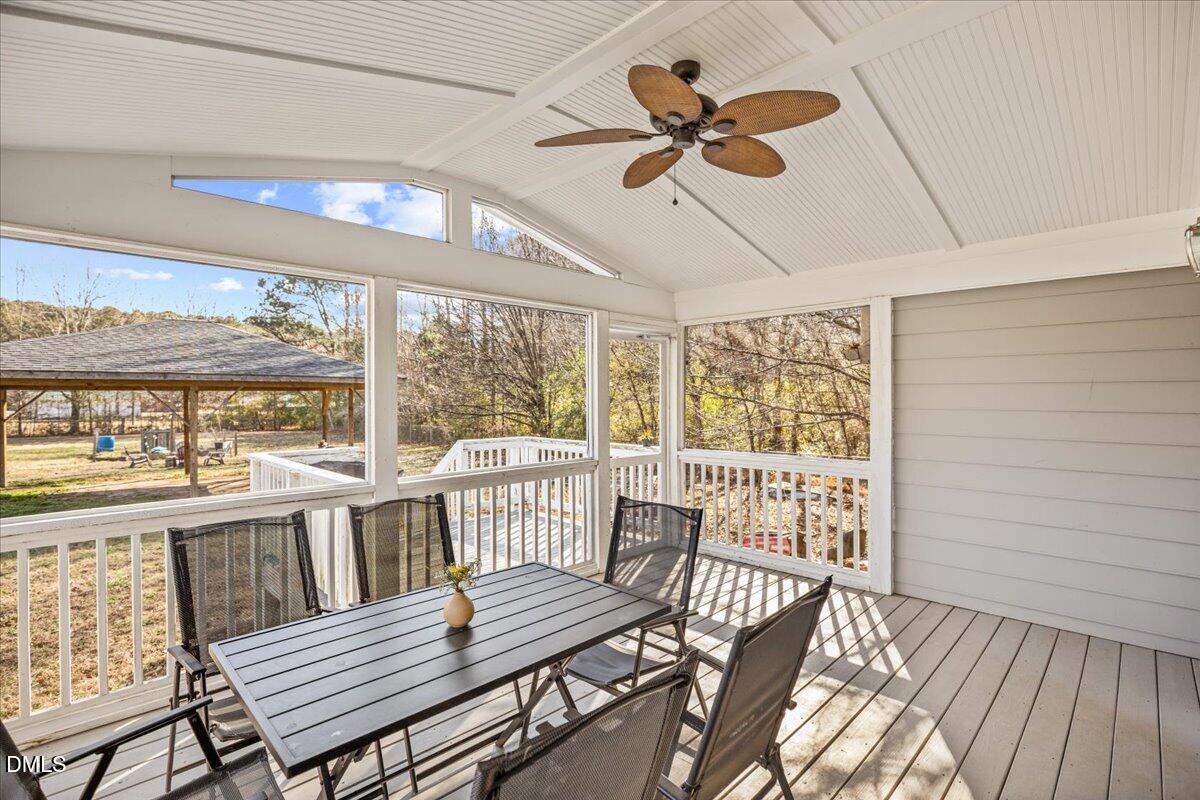 107 Claymont Road Louisburg, NC 27549 - Photo 20 of 30 a view of a dining room with furniture window and wooden floor