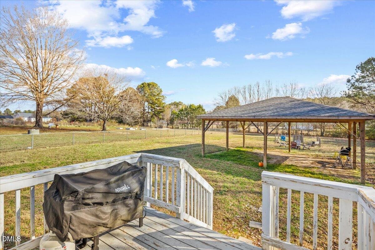 107 Claymont Road Louisburg, NC 27549 - Photo 21 of 30 a view of a house with a ocean view and a yard