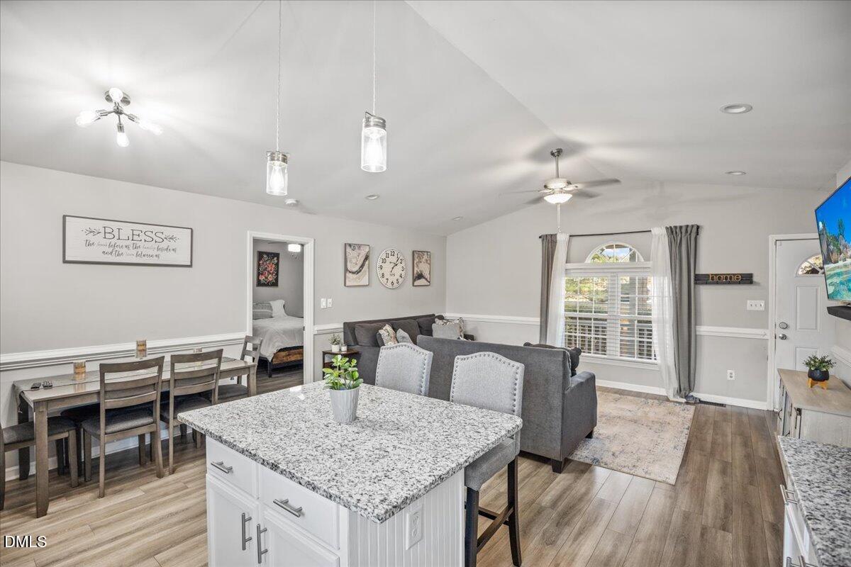 107 Claymont Road Louisburg, NC 27549 - Photo 5 of 30 a view of a dining room with furniture and wooden floor