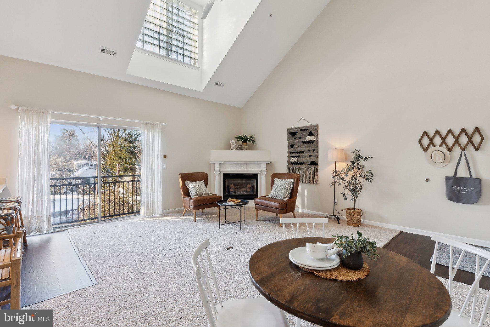 936 Bay Ridge Avenue, Unit 301 Annapolis, MD 21403 - Photo 6 of 35 Coveted corner gas fireplace anchors the room