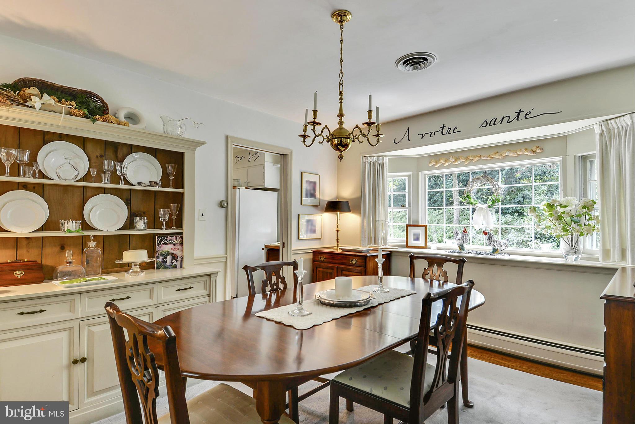 1939 Kimberly Road Silver Spring, MD 20903 - Photo 11 of 30 a view of a dining room with furniture and chandelier