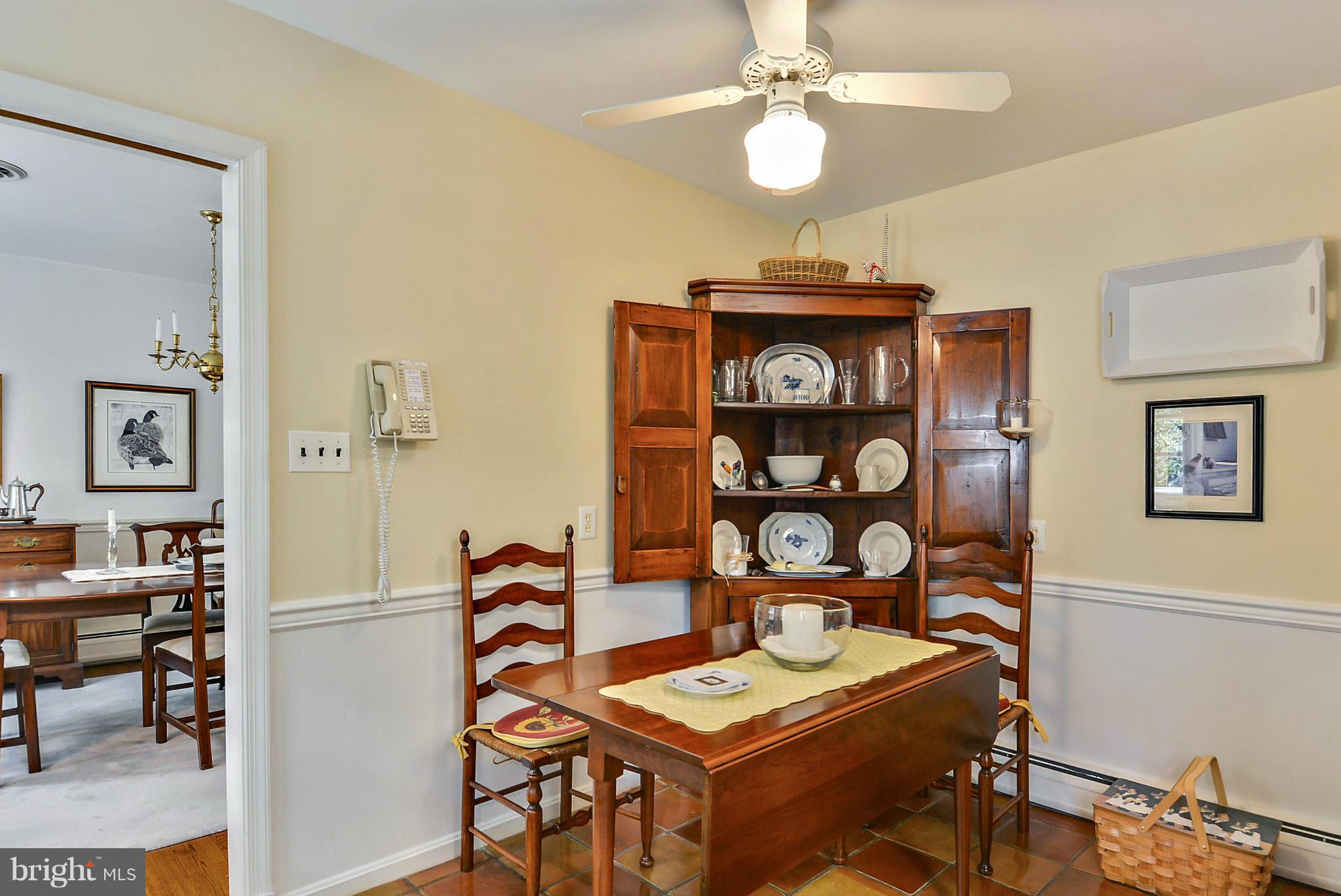 1939 Kimberly Road Silver Spring, MD 20903 - Photo 12 of 30 a view of a dining room with furniture and chandelier