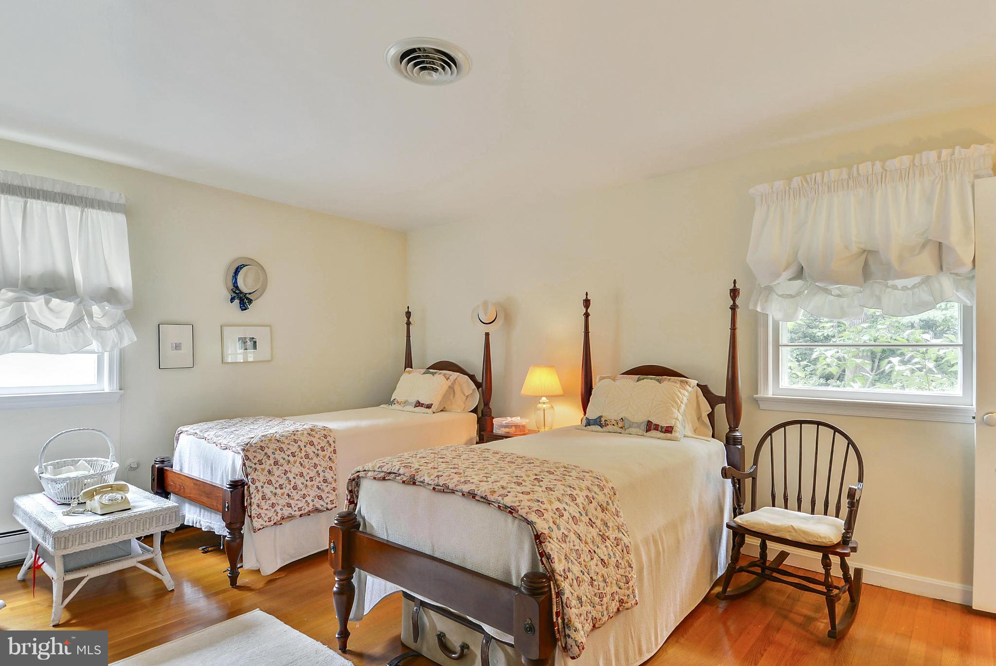 1939 Kimberly Road Silver Spring, MD 20903 - Photo 22 of 30 a bedroom with two beds and a dresser next to a window