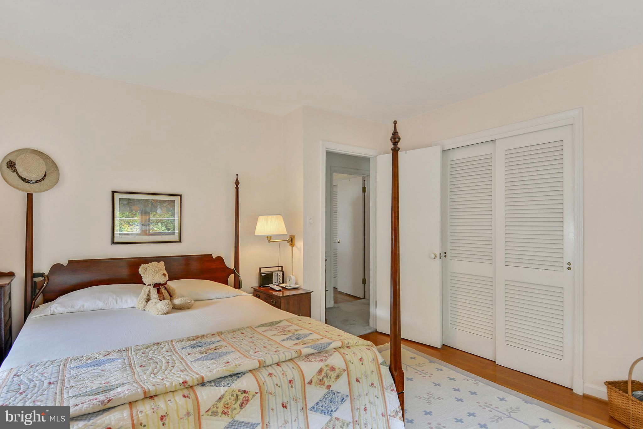1939 Kimberly Road Silver Spring, MD 20903 - Photo 24 of 30 a bedroom with a bed and a dresser with wooden floor