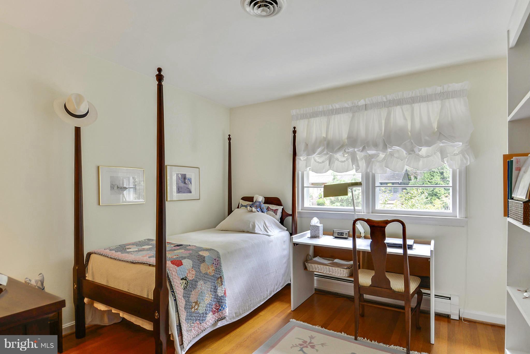 1939 Kimberly Road Silver Spring, MD 20903 - Photo 25 of 30 a bedroom with a bed and a large window