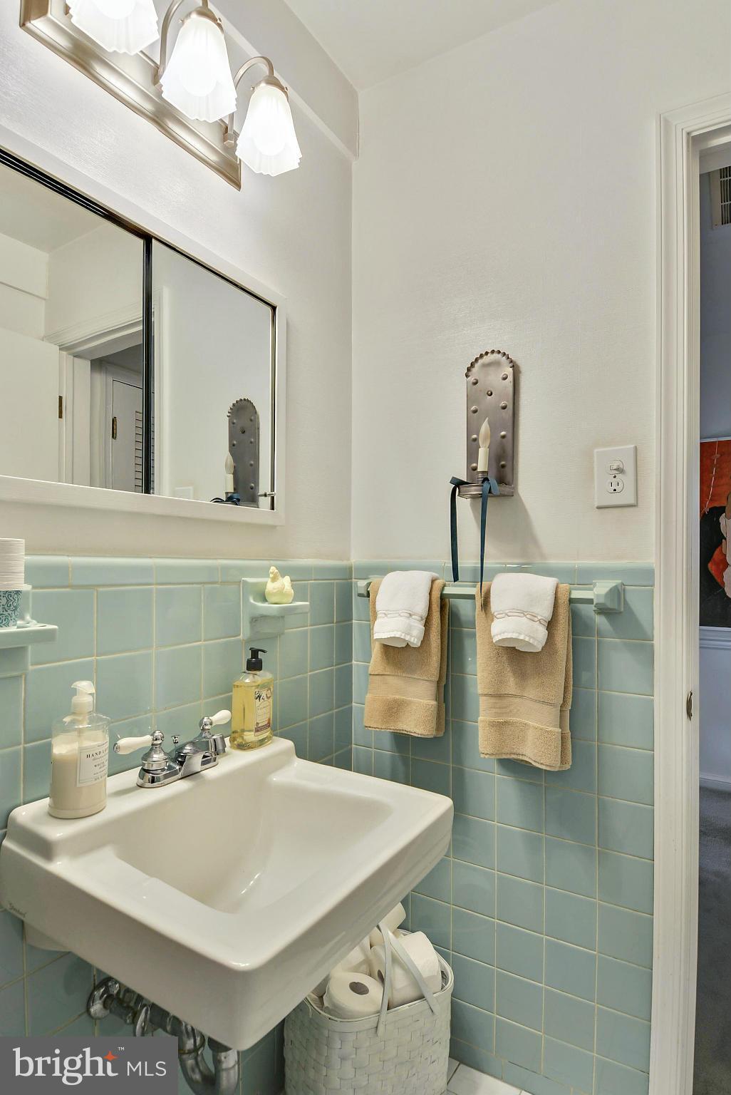 1939 Kimberly Road Silver Spring, MD 20903 - Photo 26 of 30 a bathroom with a sink and a mirror