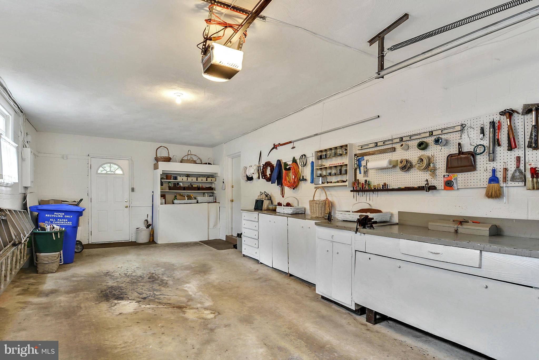1939 Kimberly Road Silver Spring, MD 20903 - Photo 6 of 30 a view of a storage & utility room with lots of clutter and cabinets