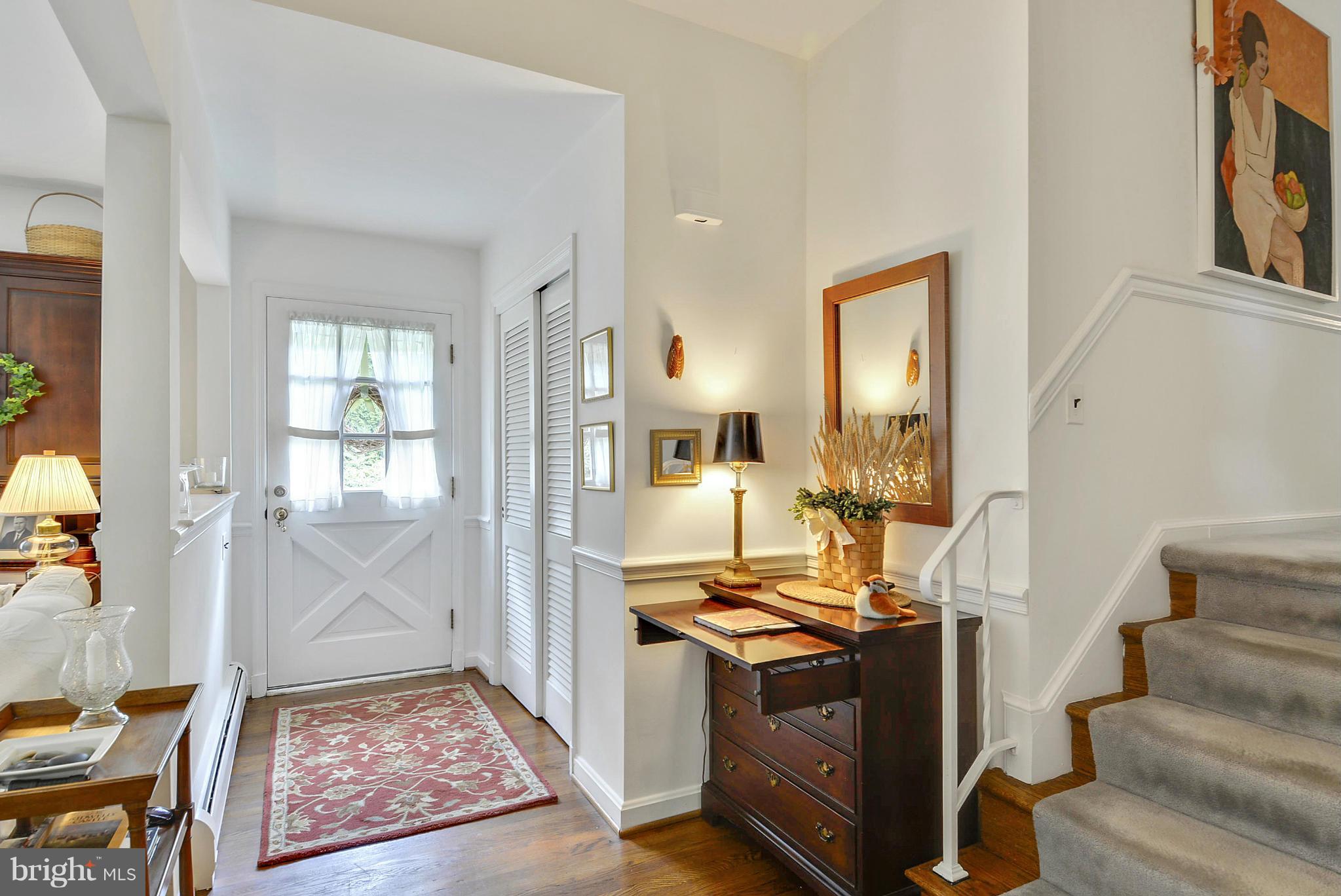1939 Kimberly Road Silver Spring, MD 20903 - Photo 7 of 30 a view of an entryway with wooden floor and a livingroom