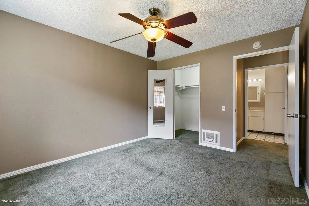 6394 Rancho Mission Road, Unit 106 San Diego, CA 92108 - Photo 12 of 23 wooden floor in an empty room