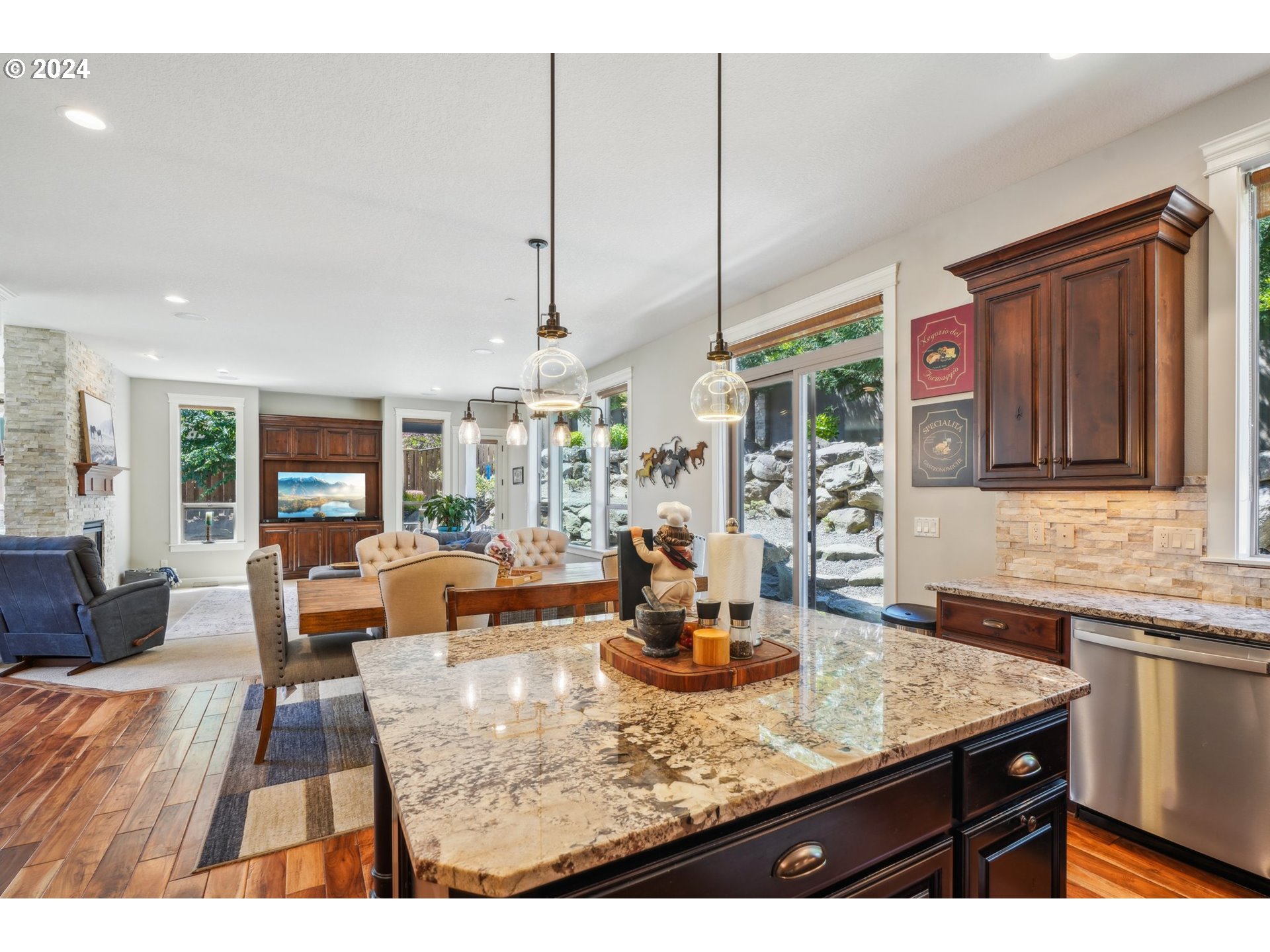 2368 Northwest 17th Avenue Camas, WA 98607 - Photo 14 of 47 a kitchen with a granite countertop sink and living room view