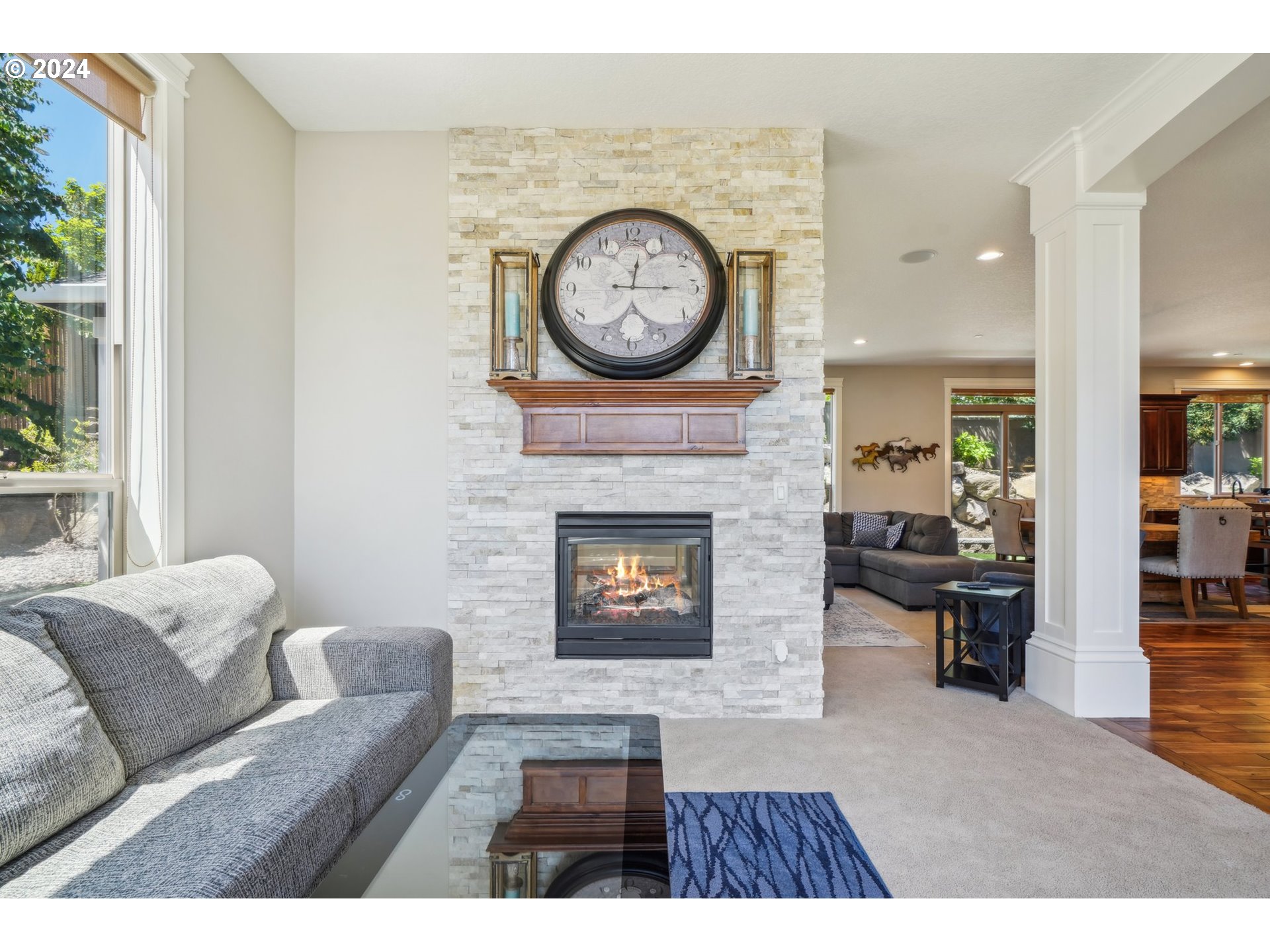2368 Northwest 17th Avenue Camas, WA 98607 - Photo 6 of 47 a living room with furniture a clock and a fireplace