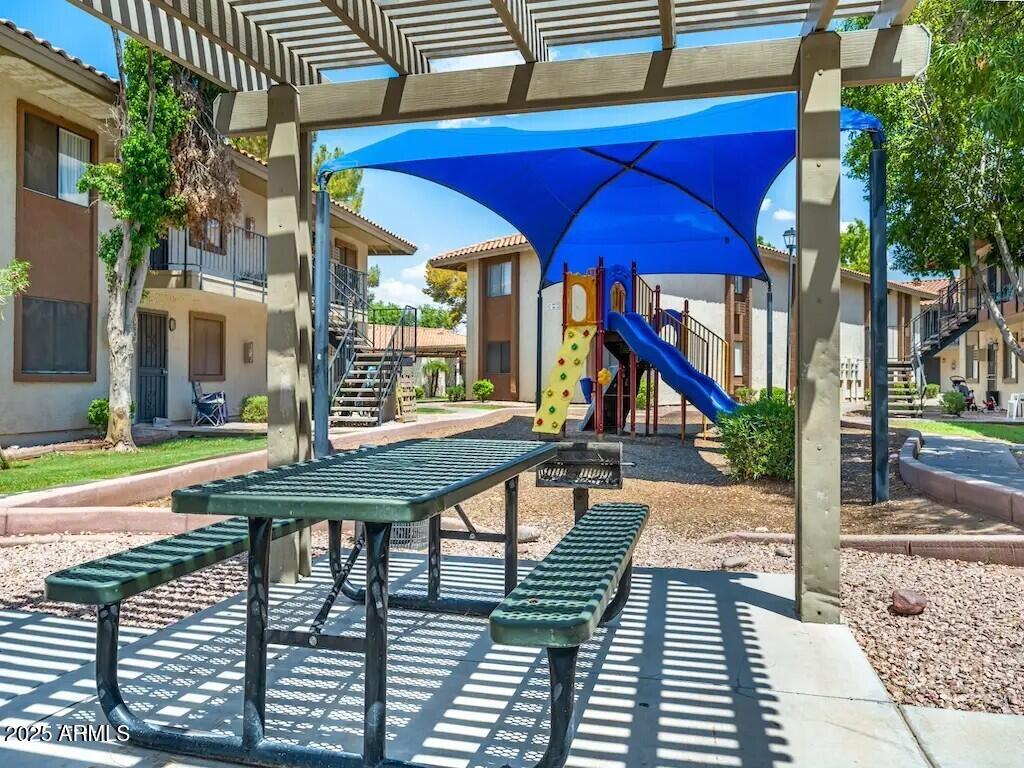 2305 East Main Street, Unit 1 Mesa, AZ 85213 - Photo 11 of 12 a view of an outdoor space pool patio and fire pit