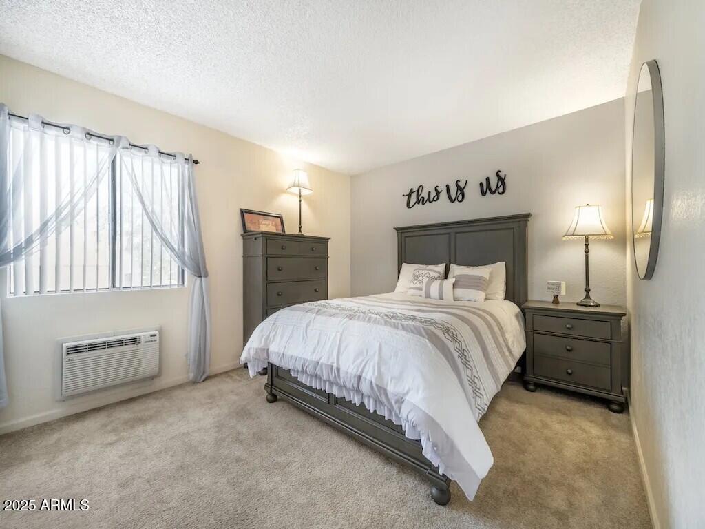 2305 East Main Street, Unit 1 Mesa, AZ 85213 - Photo 5 of 12 a bedroom with a bed and a cabinets