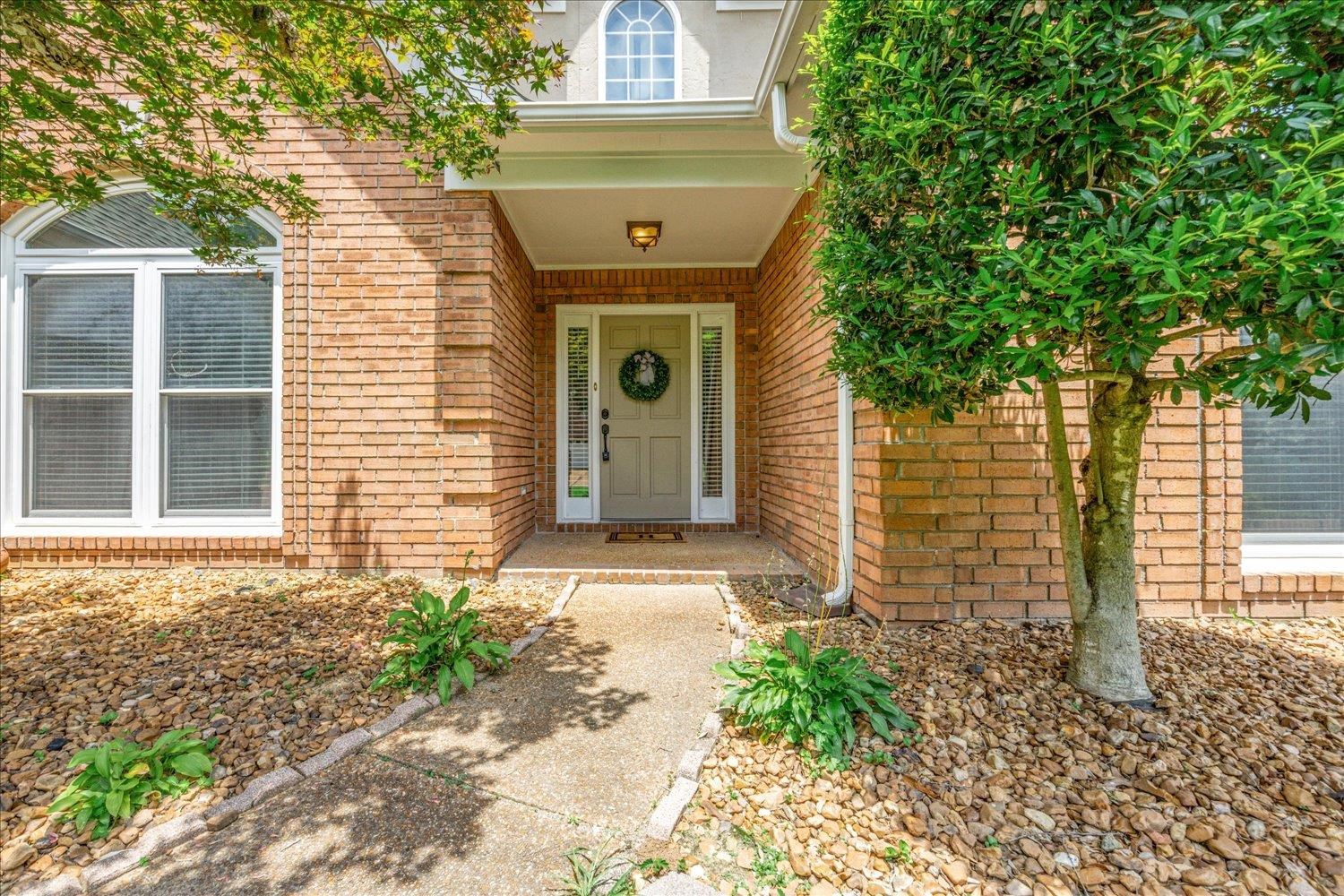 700 Belle Watley Lane Collierville, TN 38017 - Photo 14 of 30 a front view of a house with garden
