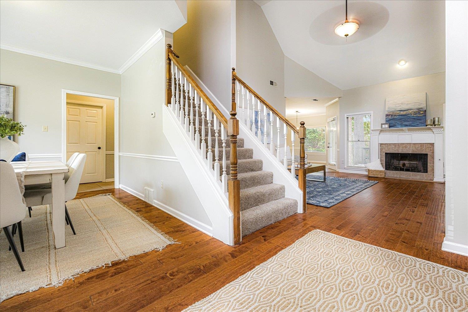 700 Belle Watley Lane Collierville, TN 38017 - Photo 19 of 30 a view of a livingroom with furniture a fireplace chandeliers and a living room