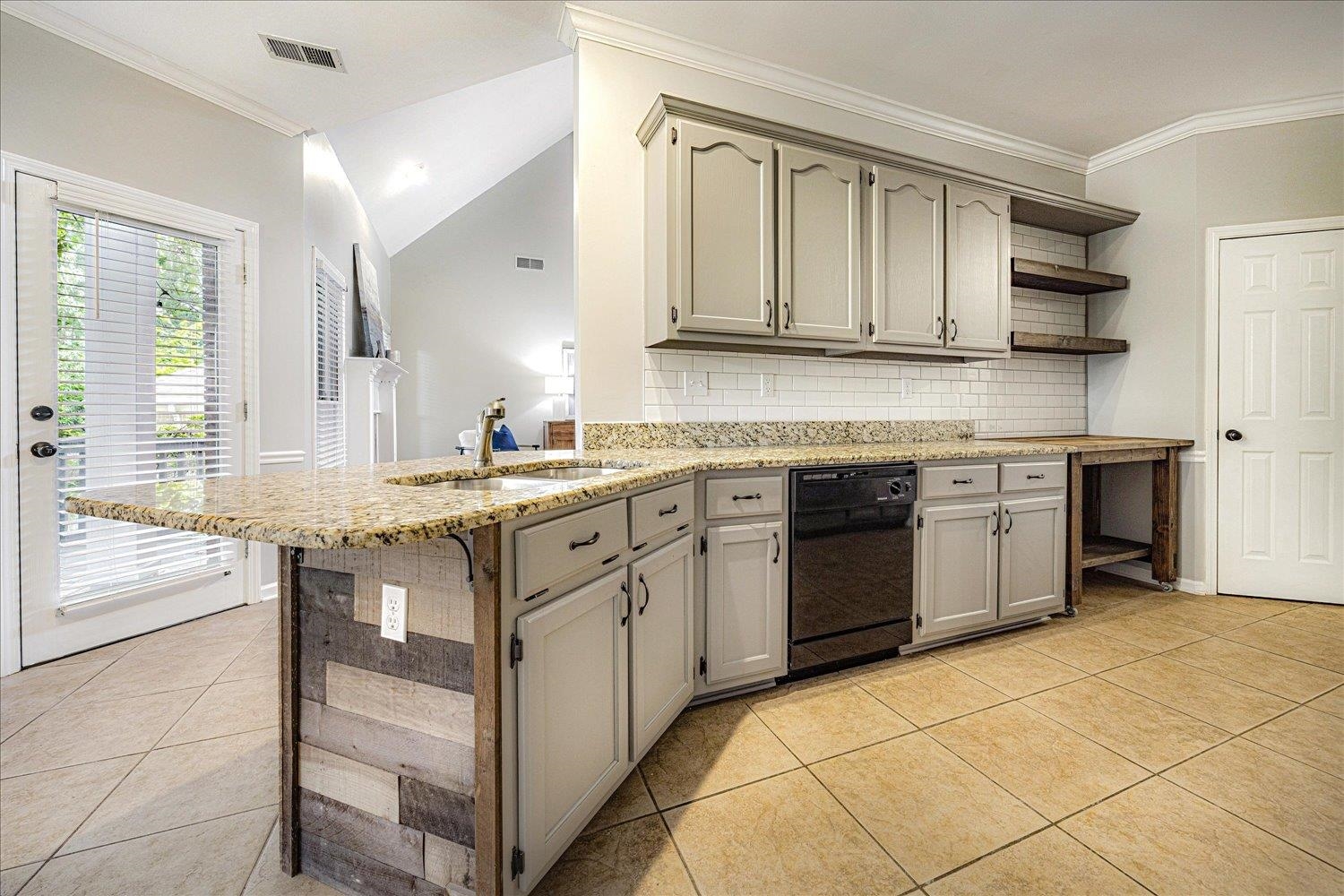 700 Belle Watley Lane Collierville, TN 38017 - Photo 21 of 30 a kitchen with a sink stove and cabinets