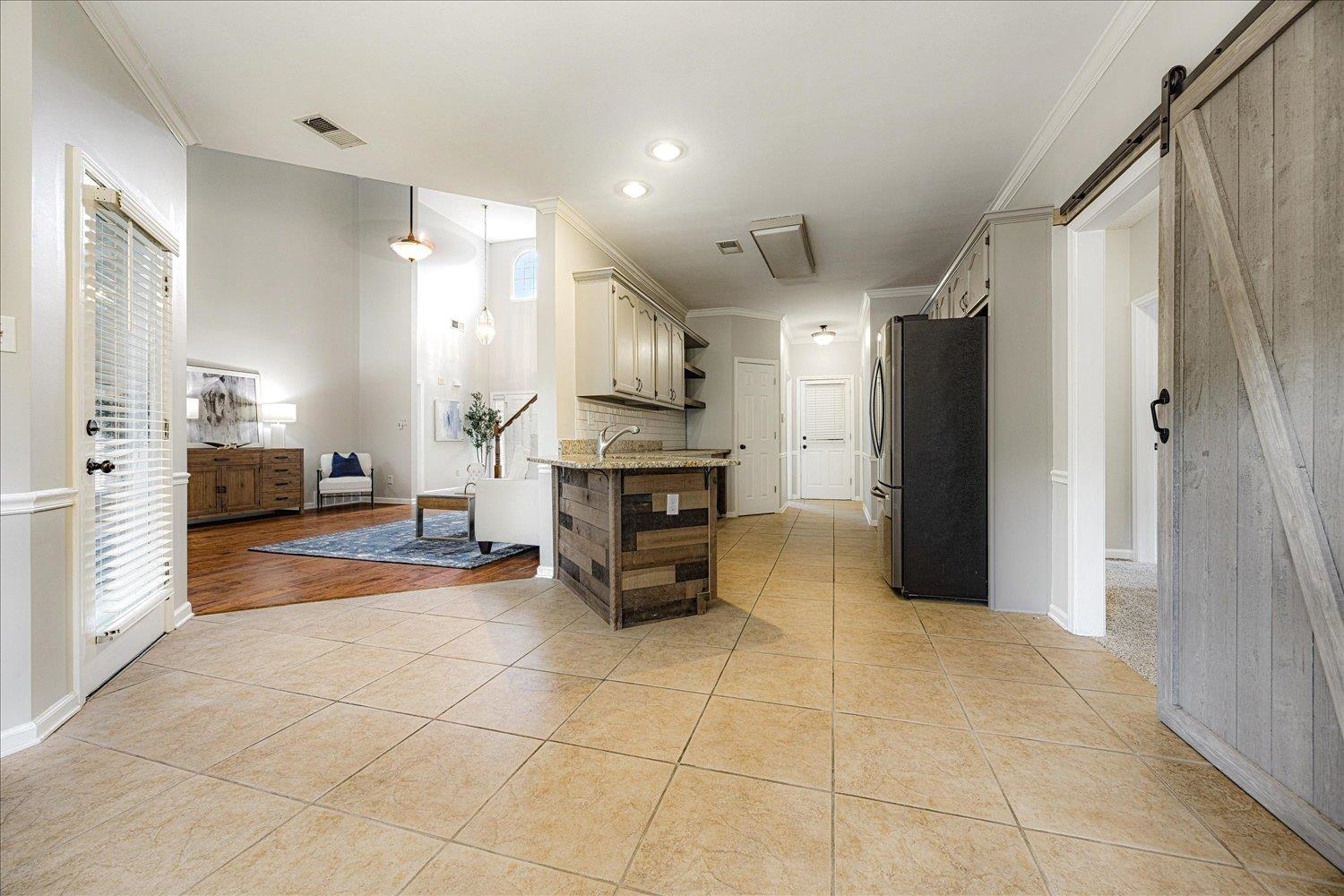 700 Belle Watley Lane Collierville, TN 38017 - Photo 22 of 30 a kitchen with stainless steel appliances kitchen island granite countertop a refrigerator and a stove top oven