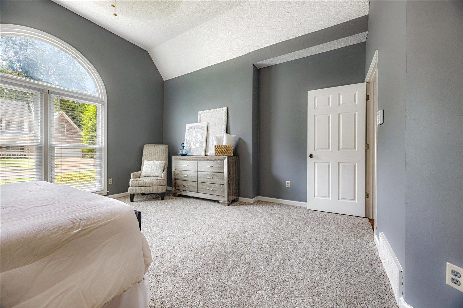 700 Belle Watley Lane Collierville, TN 38017 - Photo 27 of 30 a spacious bedroom with a bed and a window