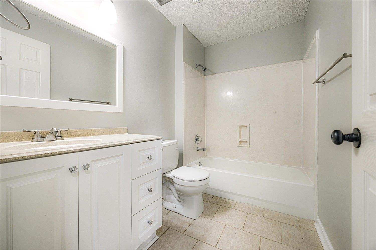 700 Belle Watley Lane Collierville, TN 38017 - Photo 4 of 30 a bathroom with a granite countertop sink a toilet and shower