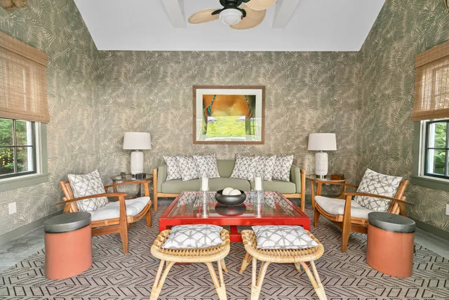 a living room with furniture and a potted plant