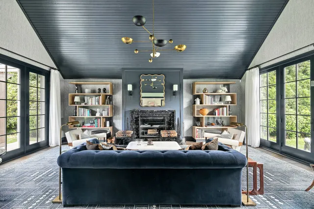 a living room with furniture window and bookshelf