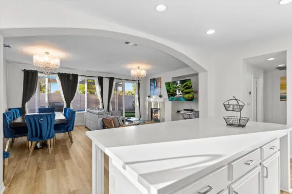 a view of living room with granite countertop furniture and a large window