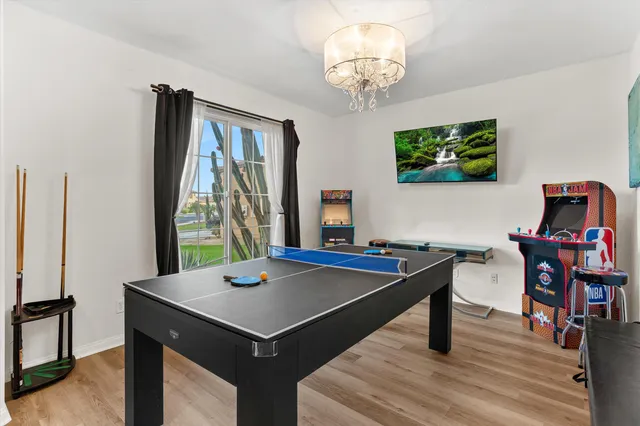 a view of a dining room with furniture and window