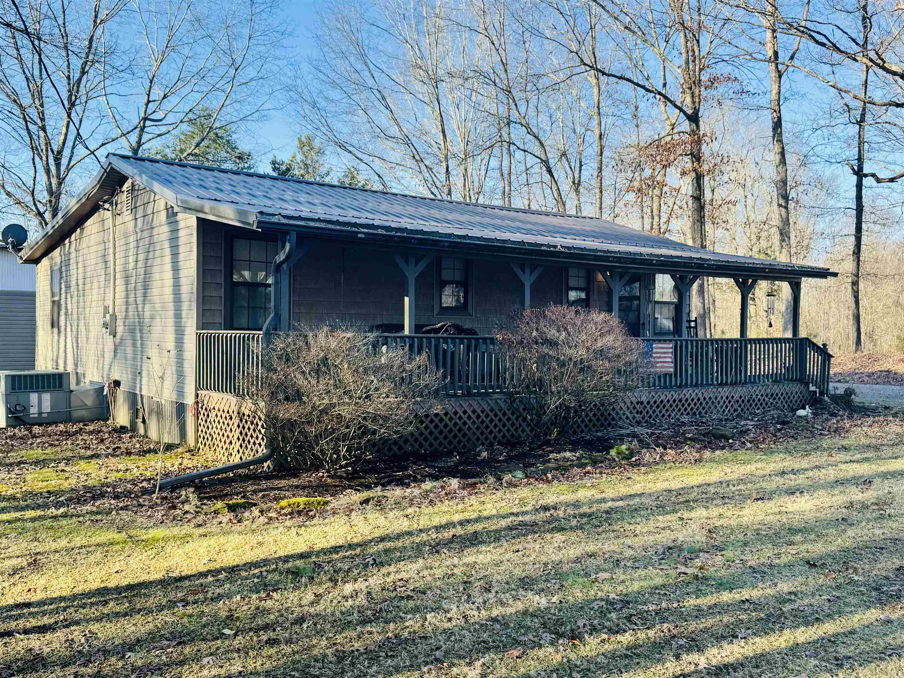 151 Williams Lane Cedar Grove, TN 38321 - Photo 12 of 40 a view of a house with a small yard plants and large tree