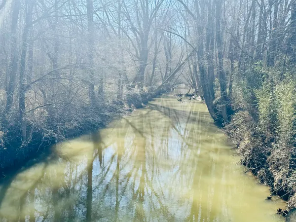 a view of lake with mountain in the background