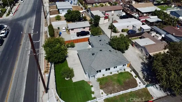 an aerial view of a house with outdoor space