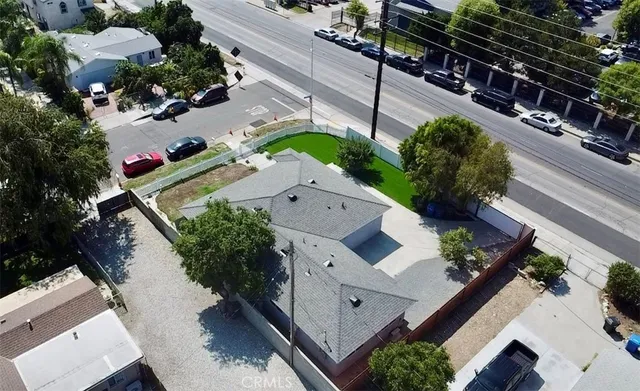 an aerial view of house with yard