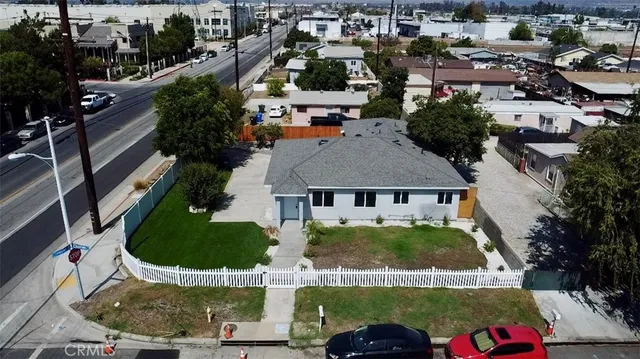 an aerial view of residential houses with outdoor space