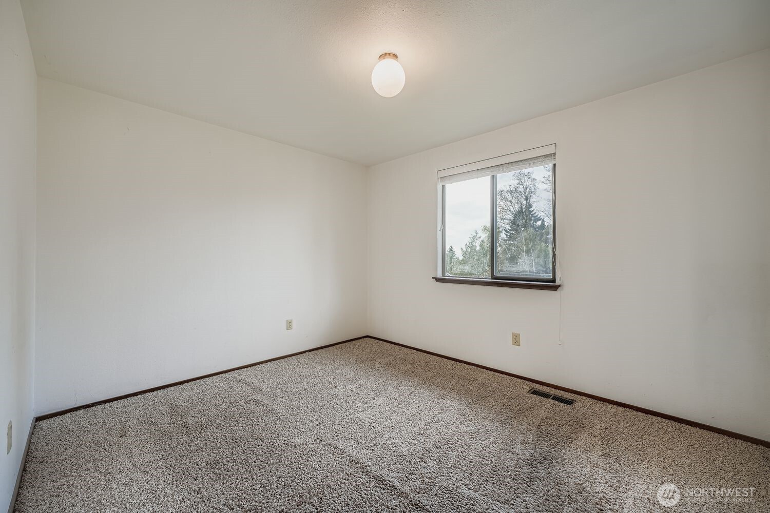 11047 26th Avenue Southwest Seattle, WA 98146 - Photo 12 of 23 an empty room with windows