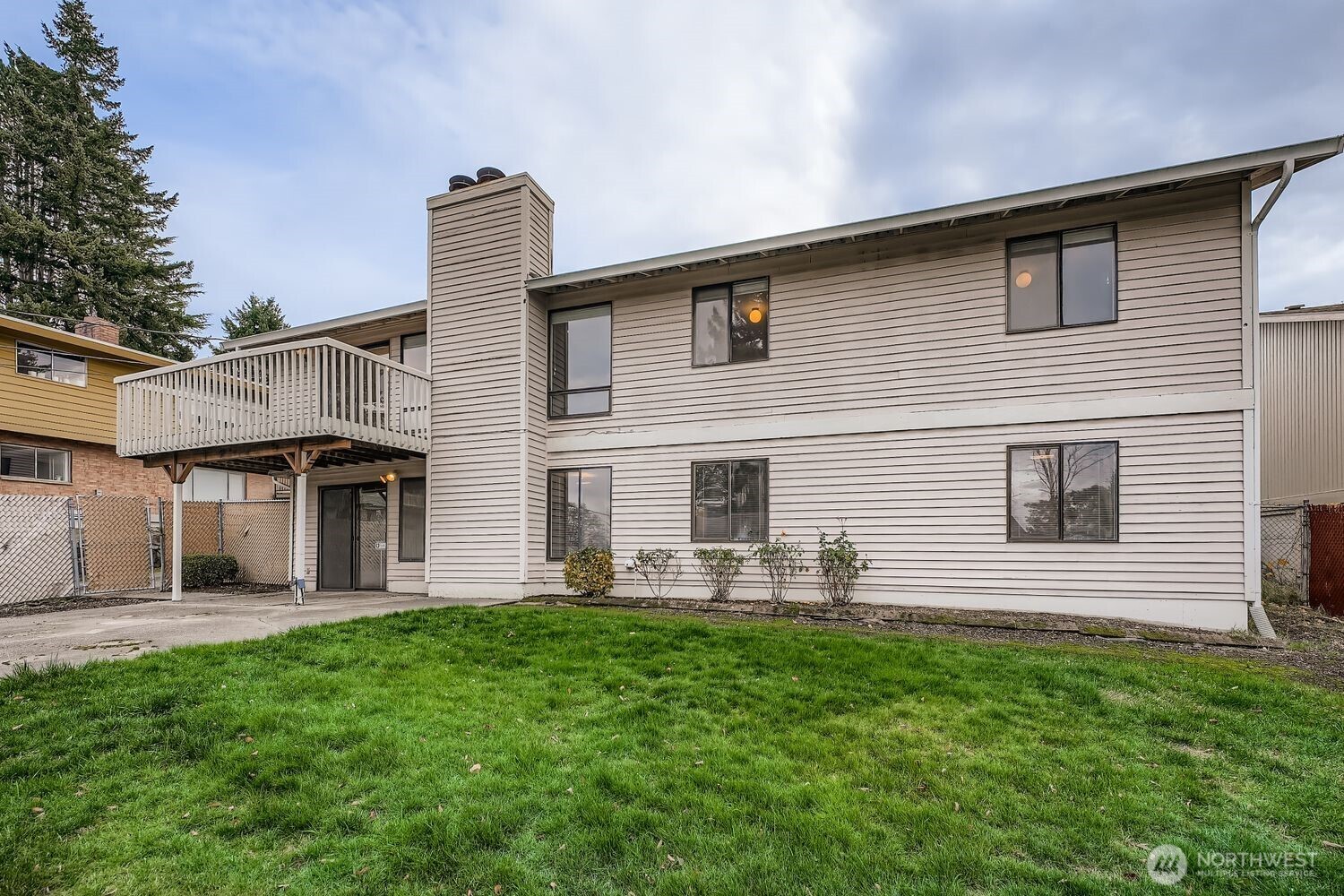 11047 26th Avenue Southwest Seattle, WA 98146 - Photo 17 of 23 a front view of house with yard and green space