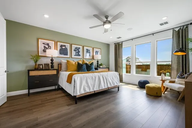 a spacious bathroom with double vanity a mirror and shower