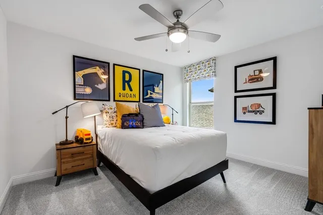 a bed room with furniture and a window