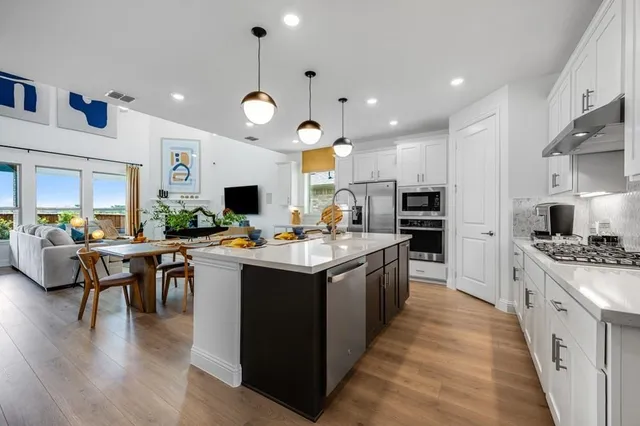 a view of a dining room with furniture and wooden floor