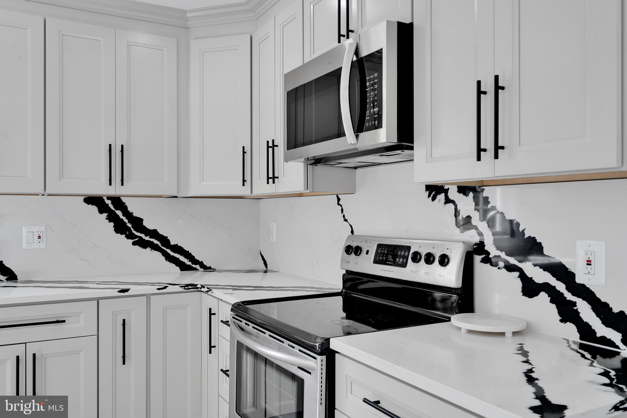 9305 4th Street Lanham, MD 20706 - Photo 12 of 45 a utility room with dryer and washer