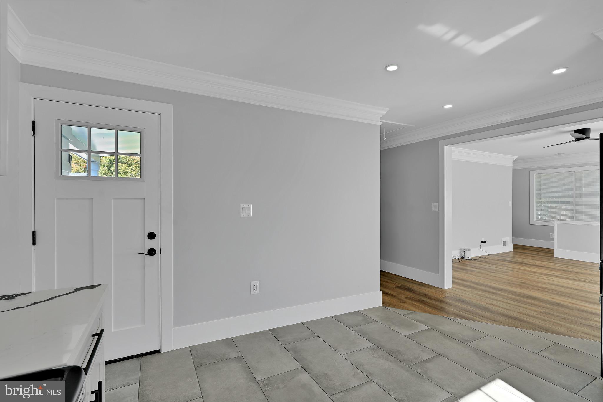 9305 4th Street Lanham, MD 20706 - Photo 13 of 45 a view of a hallway with wooden floor
