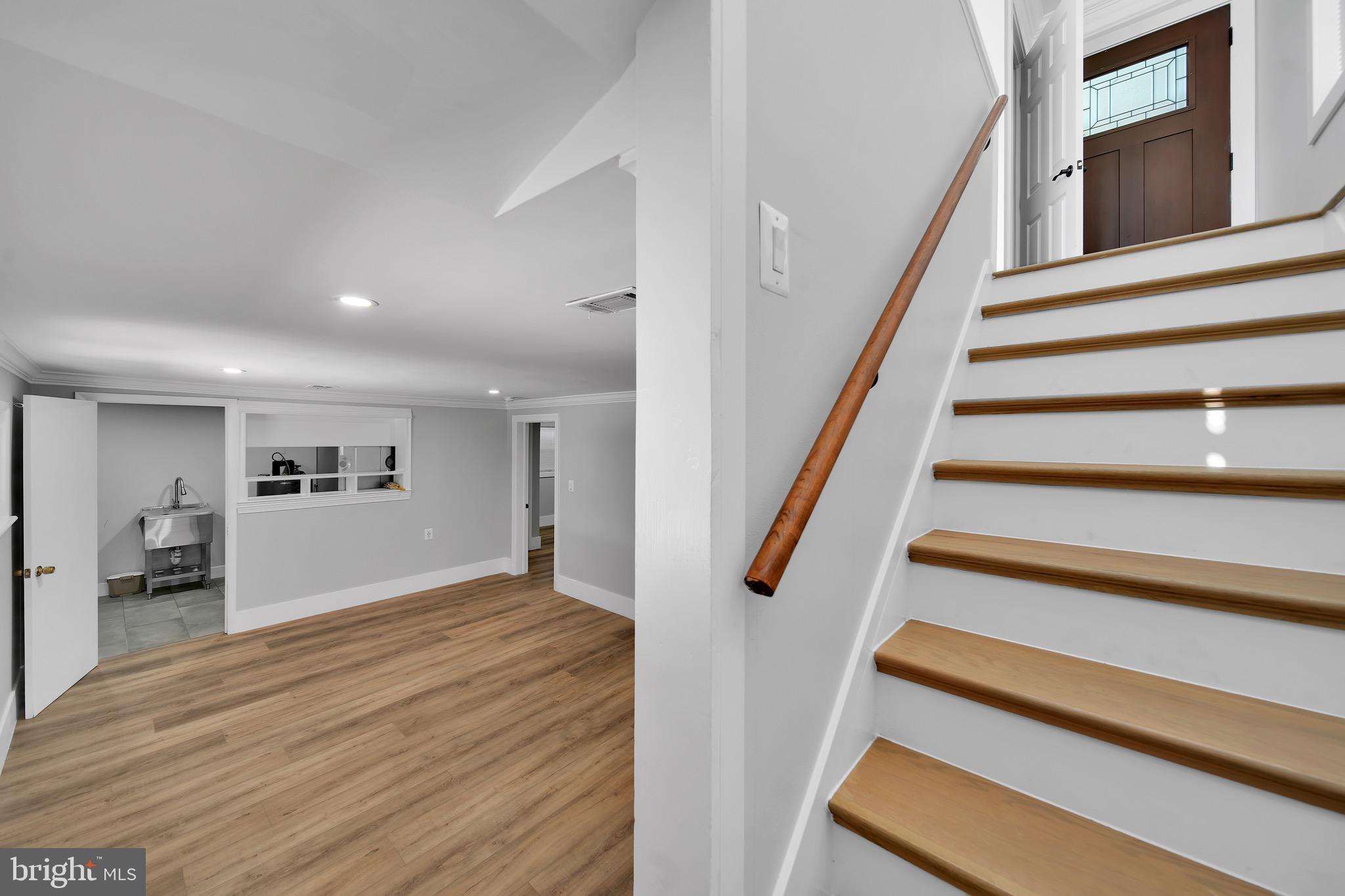 9305 4th Street Lanham, MD 20706 - Photo 22 of 45 a view of entryway and hall with wooden floor