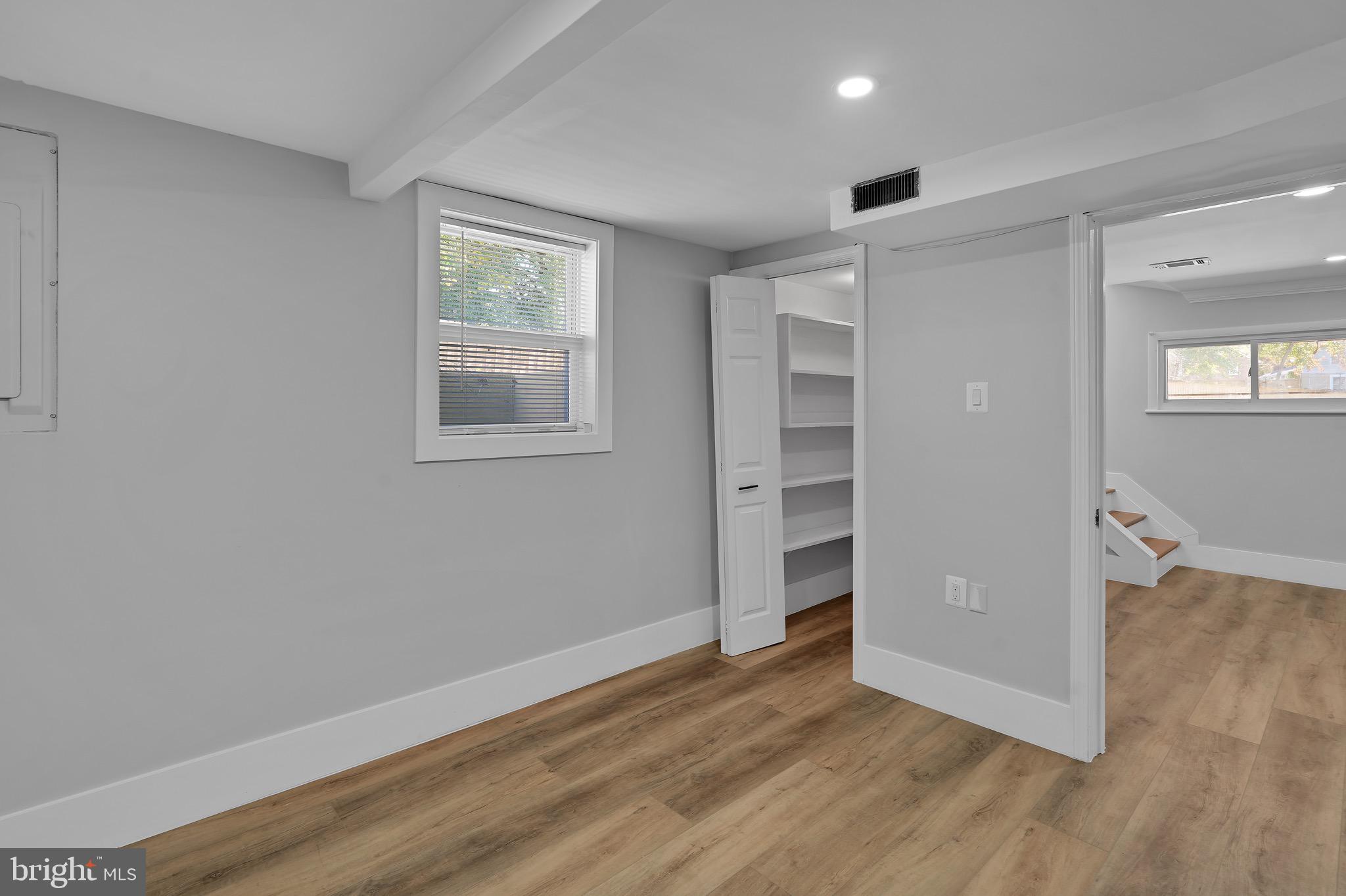 9305 4th Street Lanham, MD 20706 - Photo 33 of 45 wooden floor in an empty room with a window